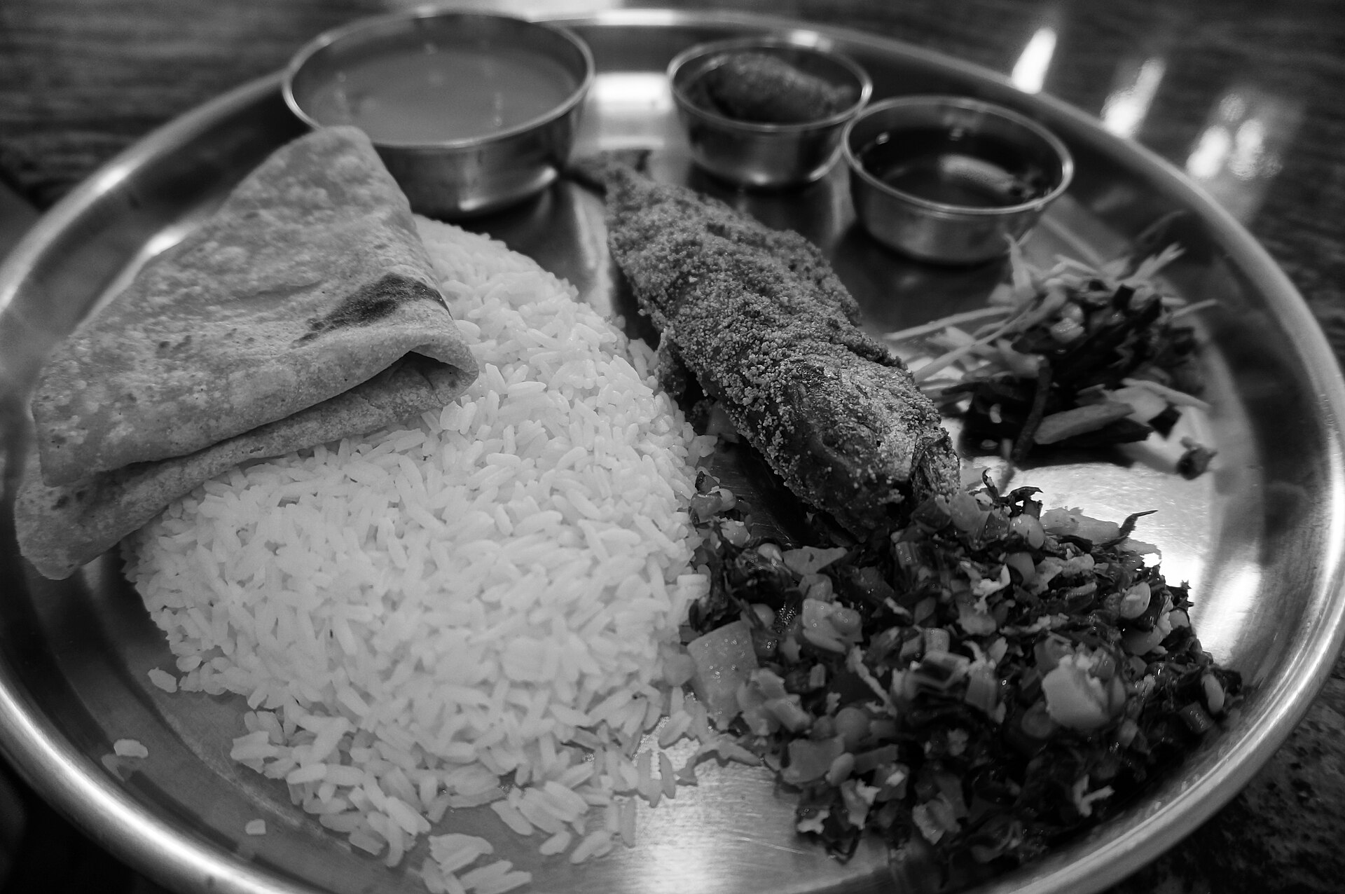 Goa Seafood | The India A Goan thali with rice, fish fry and vegetable side dishes showcases delicious indian cuisine.