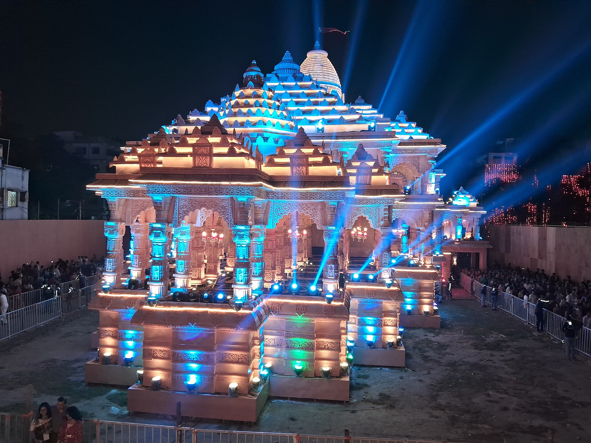 Durga Puja | India Travel An illuminated Durga Puja pandal draws crowds in Kolkata, showcasing vibrant Indian culture.