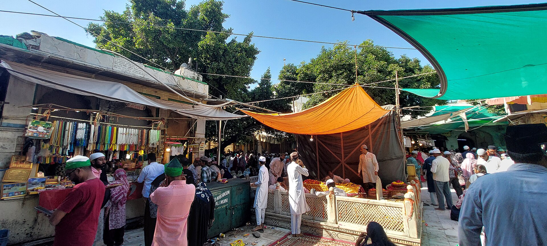 Rajasthan Market | India Travel A vibrant outdoor market scene in Rajasthan shows people browsing colorful stalls, reflecting Indian culture.