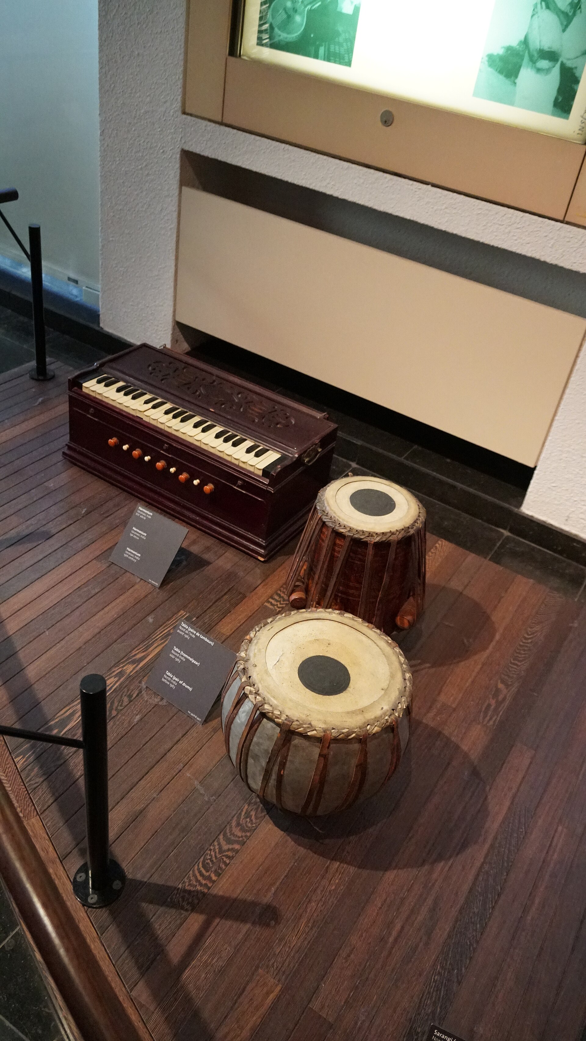Tabla & Harmonium | The India A harmonium and two tabla drums are displayed, showcasing traditional indian instruments.