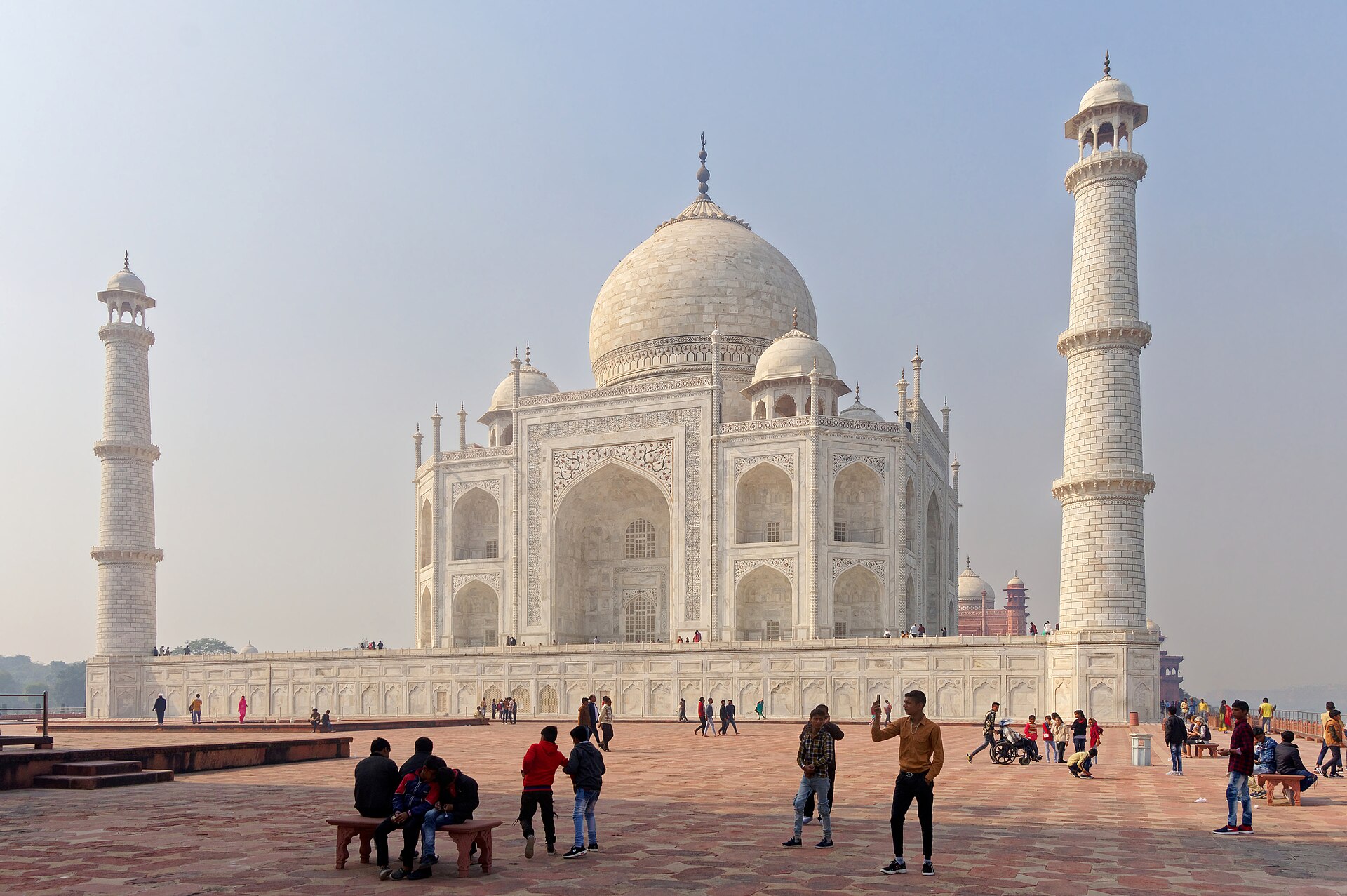 Taj Mahal | The India The Taj Mahal stands majestically with its surrounding gardens and visitors, a highlight of travel in India.