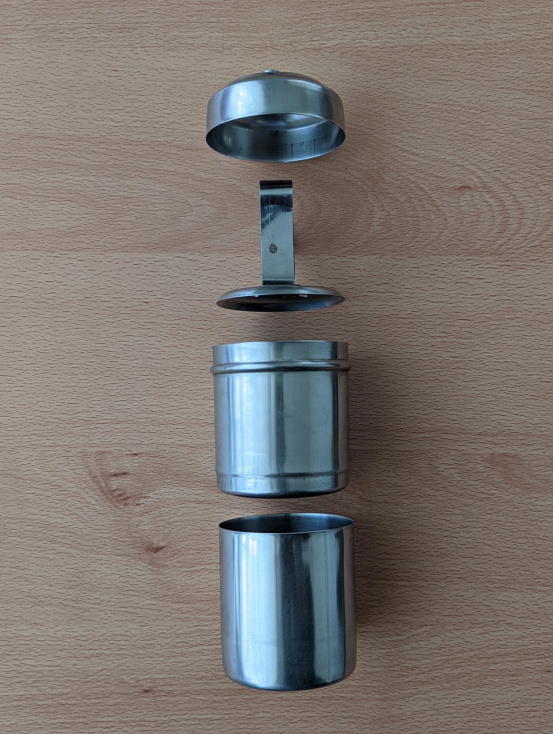 Tamil Filter Coffee | The India A disassembled stainless steel coffee filter shows the components used in making traditional Tamil filter coffee.